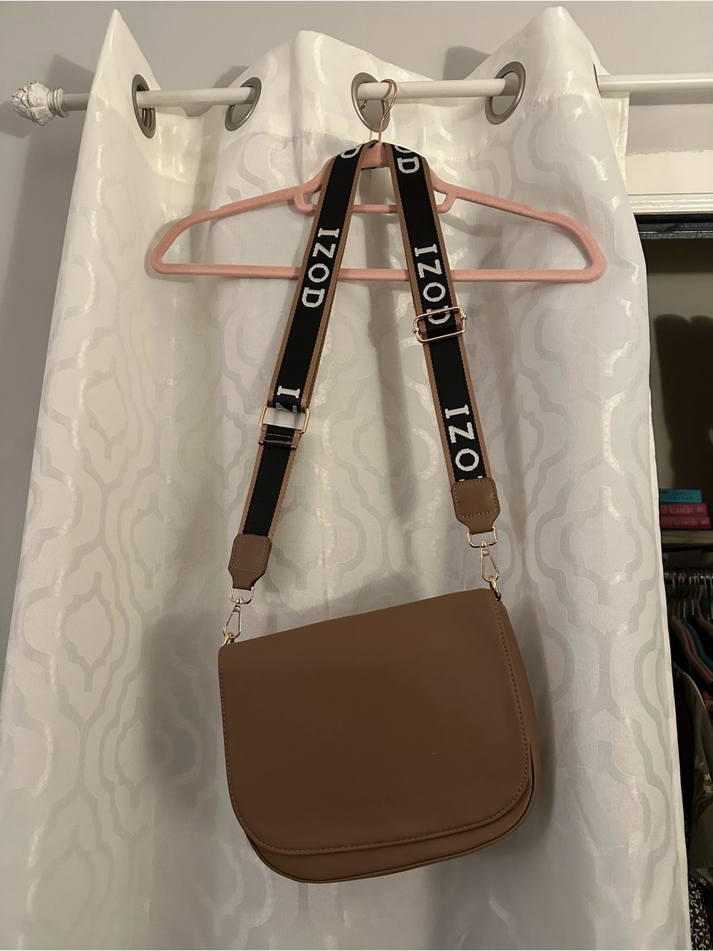Izod Tan Saddle Crossbody with Branded Black Strap